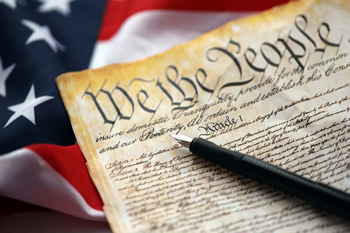 The American Constitution with an American flag